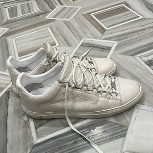Distressed off white leather sneakers with matte silver tone hardware